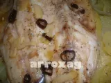 Receta Merluza al horno sobre base de papas y cebolla