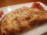 Receta Calzone de frankfurt, cebolla frita y aceite de orégano