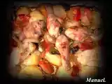 Receta Muslitos de pollo al horno con guarnición de patatas.