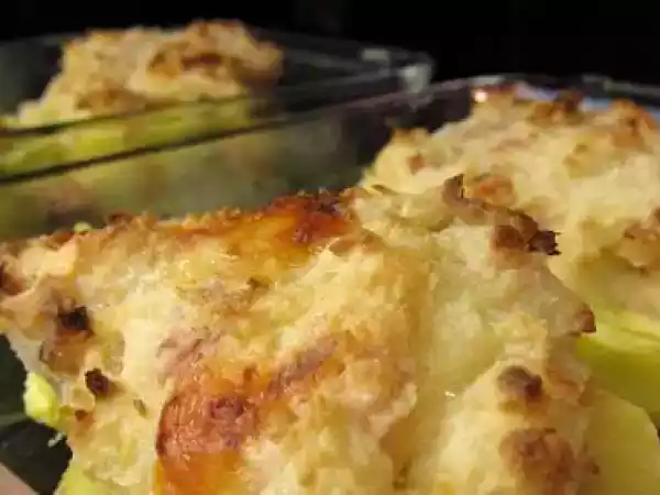 Receta Patatas gratinadas con jamón dulce y queso emmental.