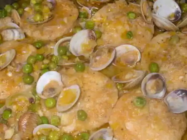 Receta Medallones de merluza con almejas.