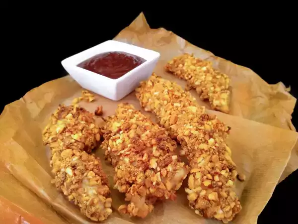 Receta Solomillos de pollo con kikos {al horno}