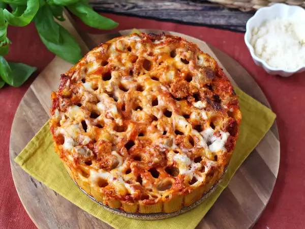 Receta Timbal de rigatoni al horno con salchicha, bechamel y mozzarella