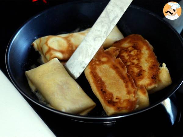 Crepes rellenos de bechamel, queso y jamón - Preparación paso 10