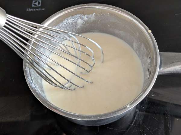 Timbal de rigatoni al horno con salchicha, bechamel y mozzarella - Preparación paso 5