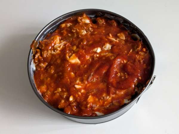 Timbal de rigatoni al horno con salchicha, bechamel y mozzarella - Preparación paso 11