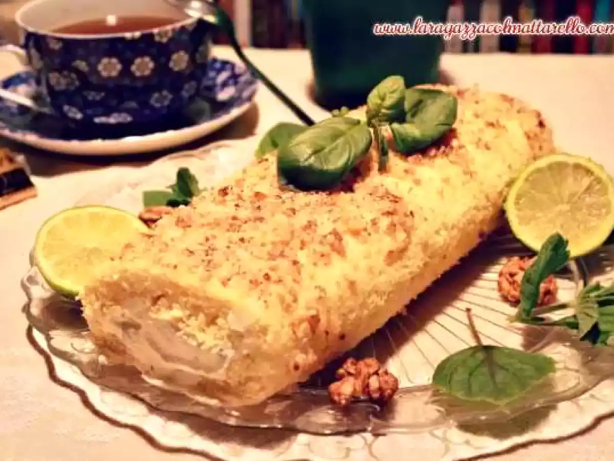 Brazo de gitano con crema de mascarpone, albahaca, miel y glasa de lima y nueces