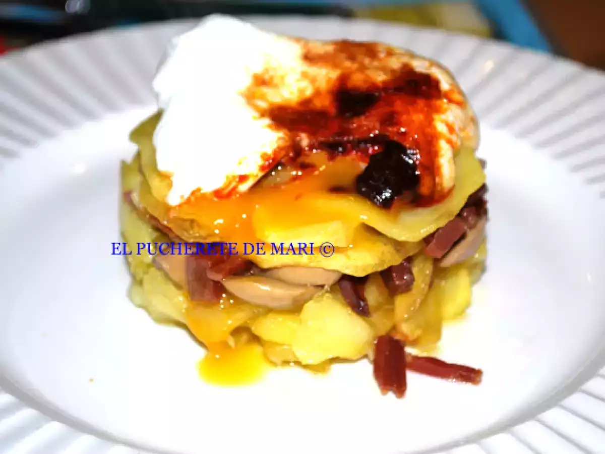 Huevo poché con pimentón de la vera y patatas panaderas