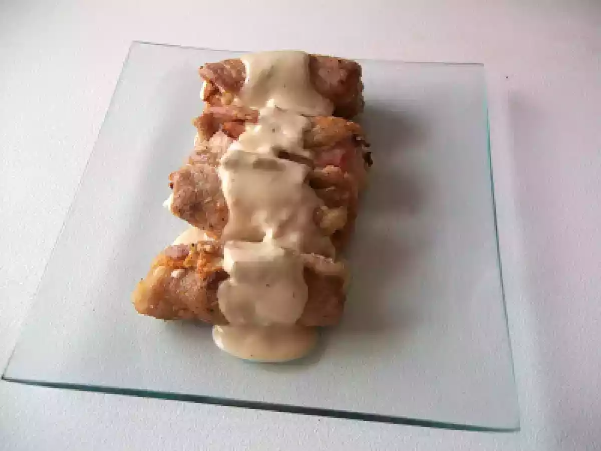 Rollitos de lomo con salsa de champiñones