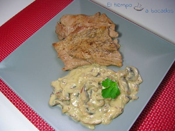 Secreto ibérico con champiñones